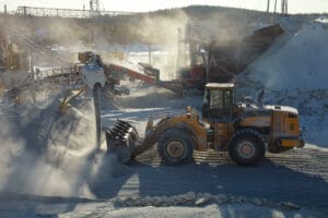 Front end,Loader,On,The,Background,Of,Stone,Crushing,Equipment,In